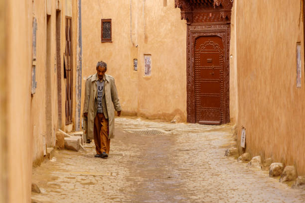 Marrakesh, Morocco - April 05, 2023: Street scene with locals, and visitors, in the Medina of Marrakesh, Morocco