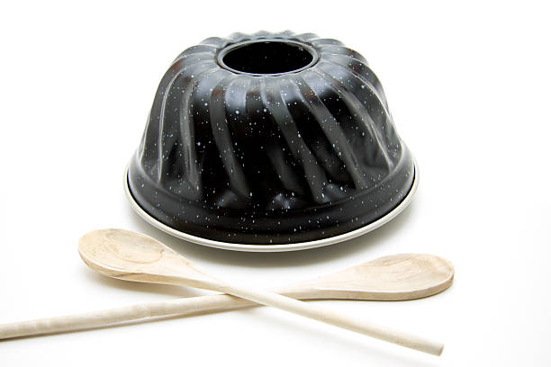 Cakes baking pan with wooden spoon