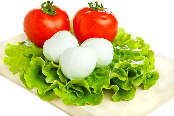 Mozarella cheese with tomato and salad stock photo