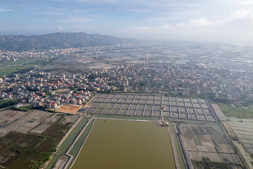 Salt fields and surrounding villages in the mist