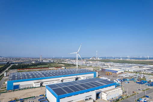 Aerial view of solar panels on the roof of a wind turbine renovation plant