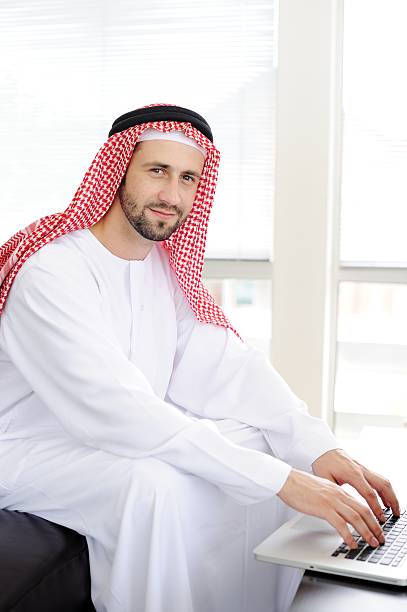 istock Portrait of a smart arabic business man using laptop 178563717