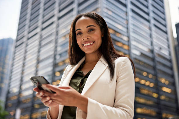 istock Young corporate professional outdoors with portable device 1785640529