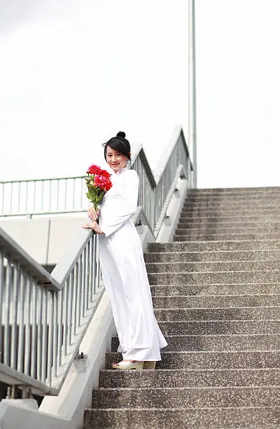 Vietnamese high school girl in white traditional dress aodai, ao dai