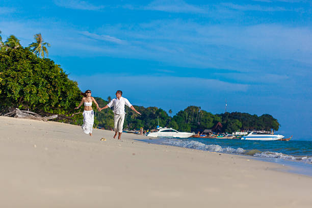istock running couple on a tropical beach 178565278