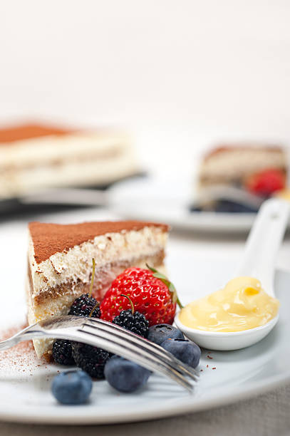 istock tiramisu dessert with berries and cream 178565717