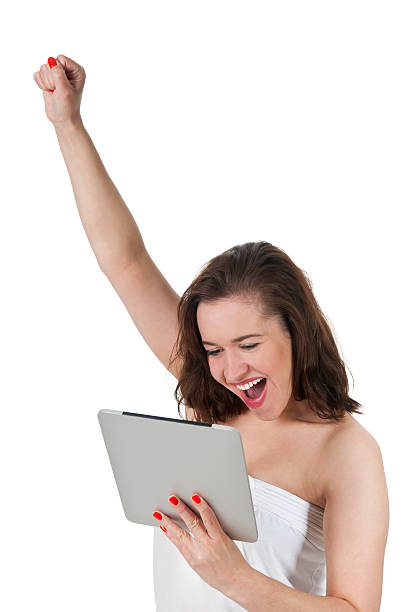 istock excited young woman with tablet pc 178565735