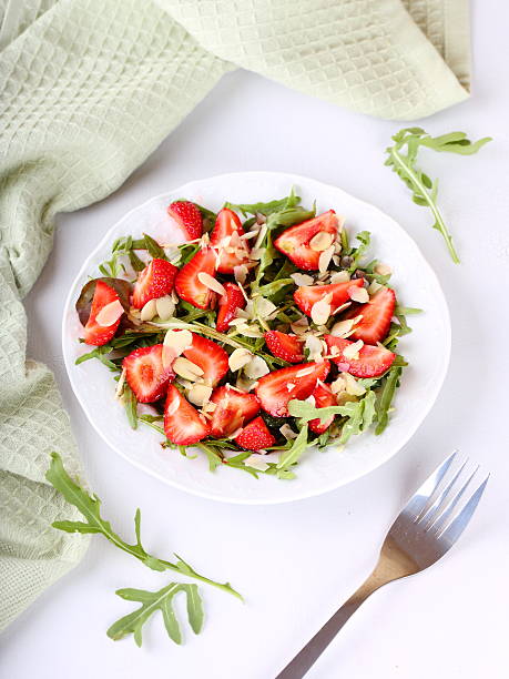 istock salad of strawberries, arugula and almonds 178566306