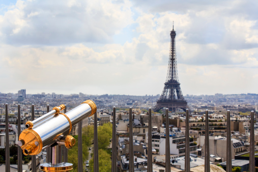 Observation telescope pointed to Eiffel tower / view from the rooftop of the Arc de triomphe, Paris, France