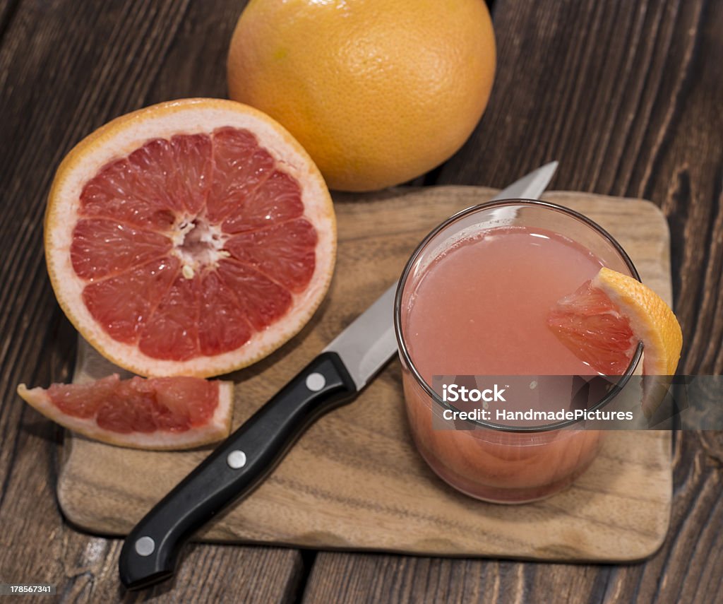 Fresh made Grapefruit Juice Fresh made Grapefruit Juice on wooden background Breakfast Stock Photo