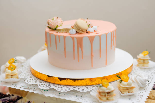 istock Pastel cake decorated with flowers and macaroon 1785677246