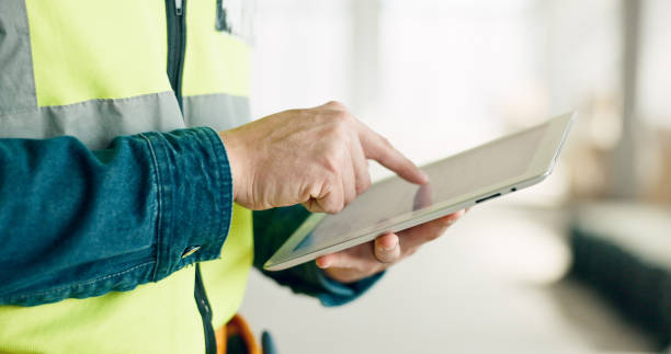 istock Construction worker, hands and tablet for planning, logistics and project management on site with online blueprint or plans. Civil engineering, project and man check industrial design on technology 1785677258