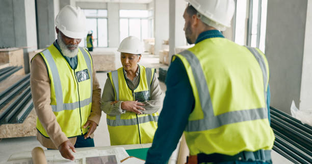 istock Discussion, blueprint and team of construction workers in collaboration for building renovation. Industry, engineering and group of contractors in meeting for project development planning on site. 1785677292