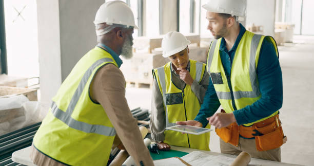 istock Discussion, tablet and team of construction workers in collaboration for building renovation. Industry, civil engineering and group of contractors in meeting for project development planning on site. 1785677298