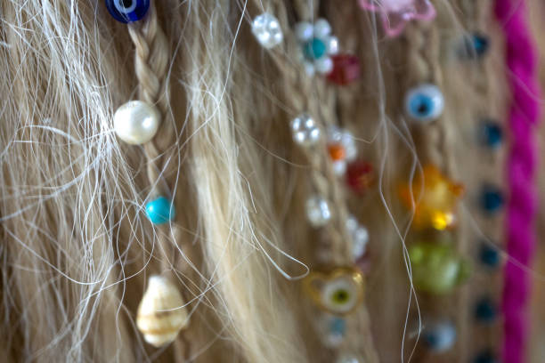 A vivid jumble of colorful yarns and strings hangs on a clothesline, creating a lively, creative scene full of texture and energy. Ideal for craft, color, and art themes.