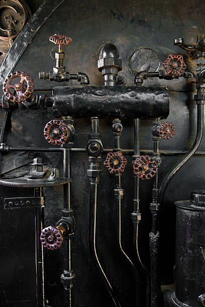 istock Nozzles and pipes on a steam engine boiler. 178568212