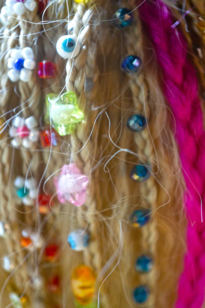 Small decorative beads attached to human hair