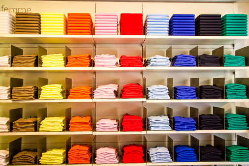 Multi-colored folded T-shirts in the department store