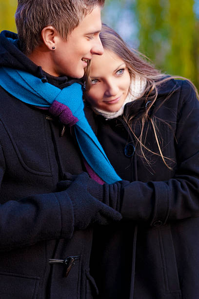 istock happy couple standing together and relaxing 178569520