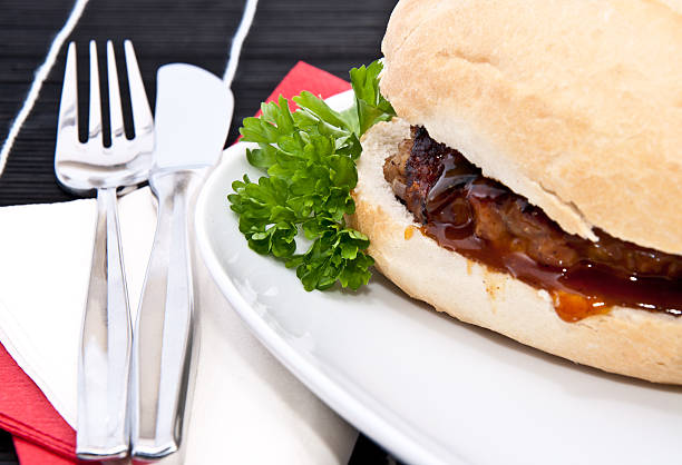 istock Burger on a roll with cutlery 178570760