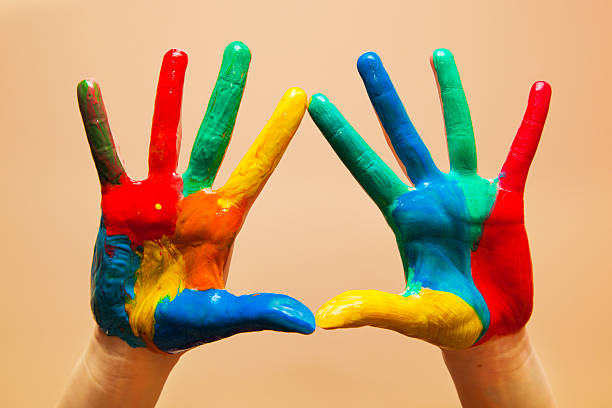 istock Painted hands, colorful fun. Orange background 178571369