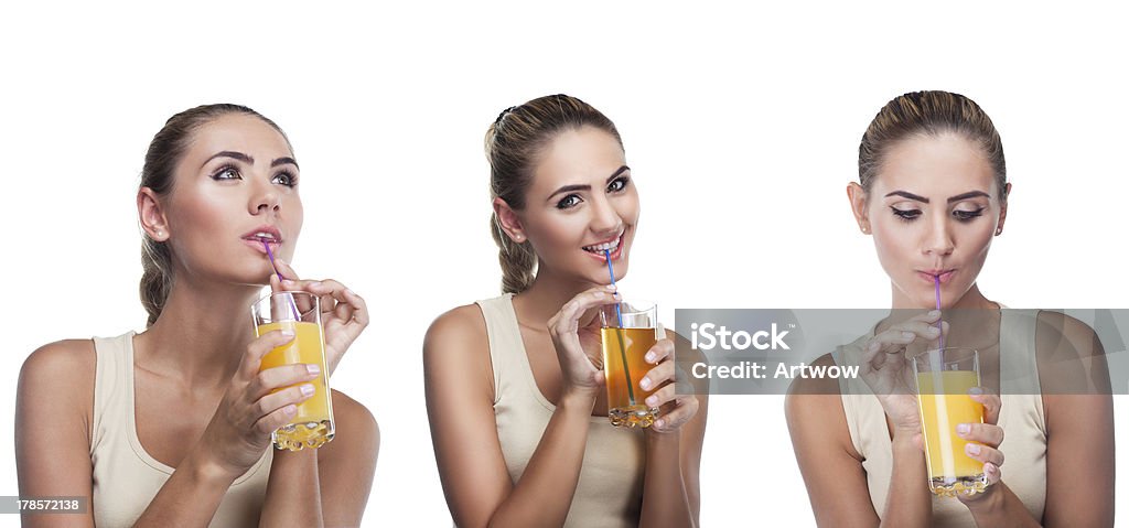 Portrait of happy young woman with juice on white backg Close-up portrait of happy young woman with juice on white background.  Concept vegetarian dieting - healthy food Adult Stock Photo