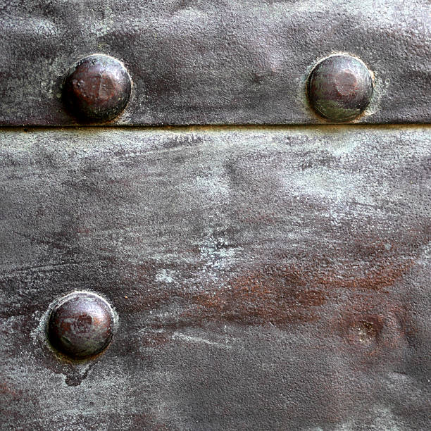 istock Black metal plate or armour texture with rivets 178572191