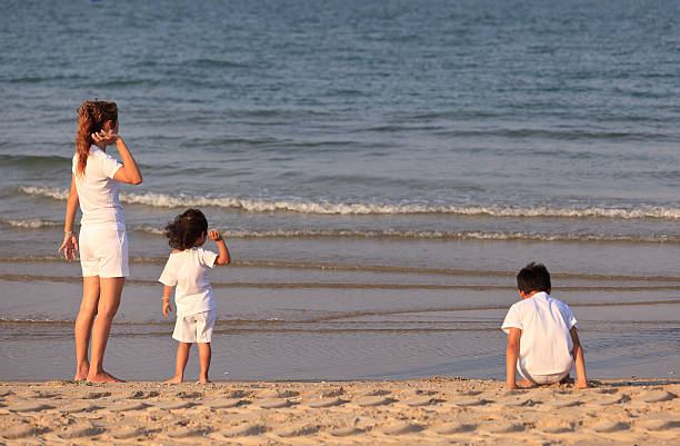 istock Asian mom and son on beach 178572298