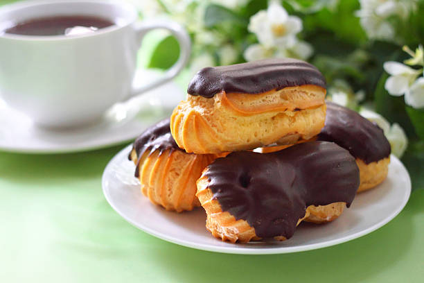 istock Eclairs with cream in chocolate coating 178572915