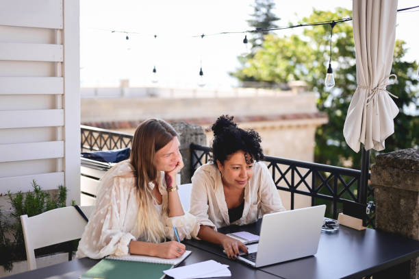 istock Two adult students working on project outdoors. 1785734120