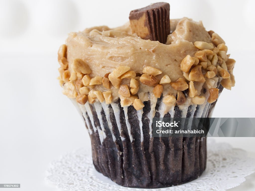 Cupcake Gourmet Reese's peanut butter cups cupcake on white backround. Baked Stock Photo