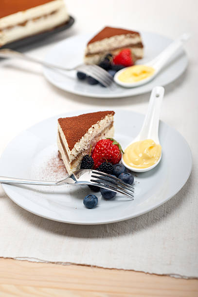 istock tiramisu dessert with berries and cream 178575028