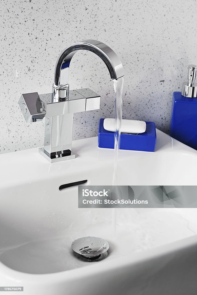 Modern sink mixer tap Mixer tap on a contemporary modern bathroom sink Bar Of Soap Stock Photo