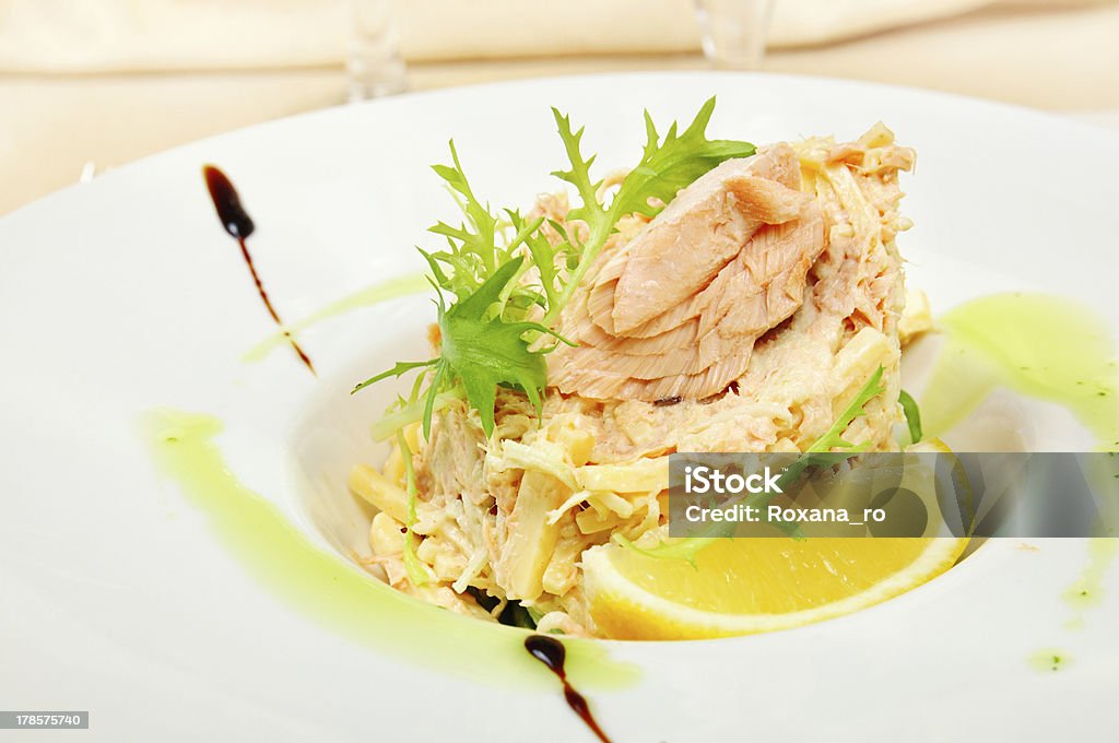 Tuna salad Tuna salad decorated with a rosemary leaf in a restaurant Appetizer Stock Photo