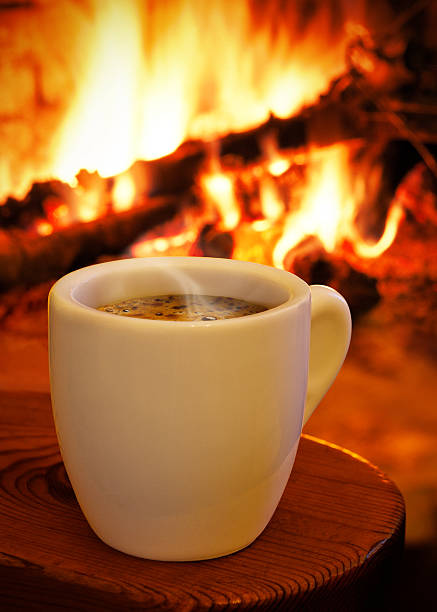 istock Cup of hot coffee in front the fireplace 178577046