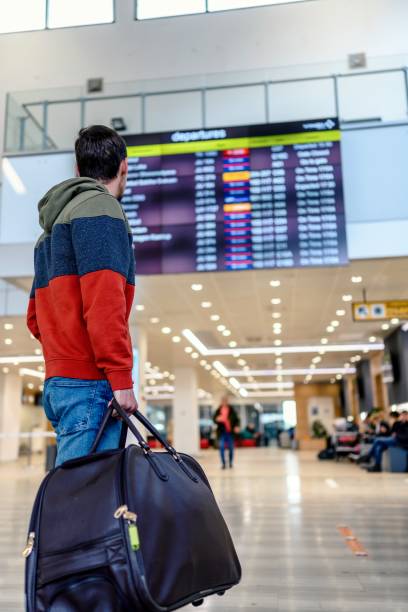 istock Young man check a flight at the international airport. 1785772542