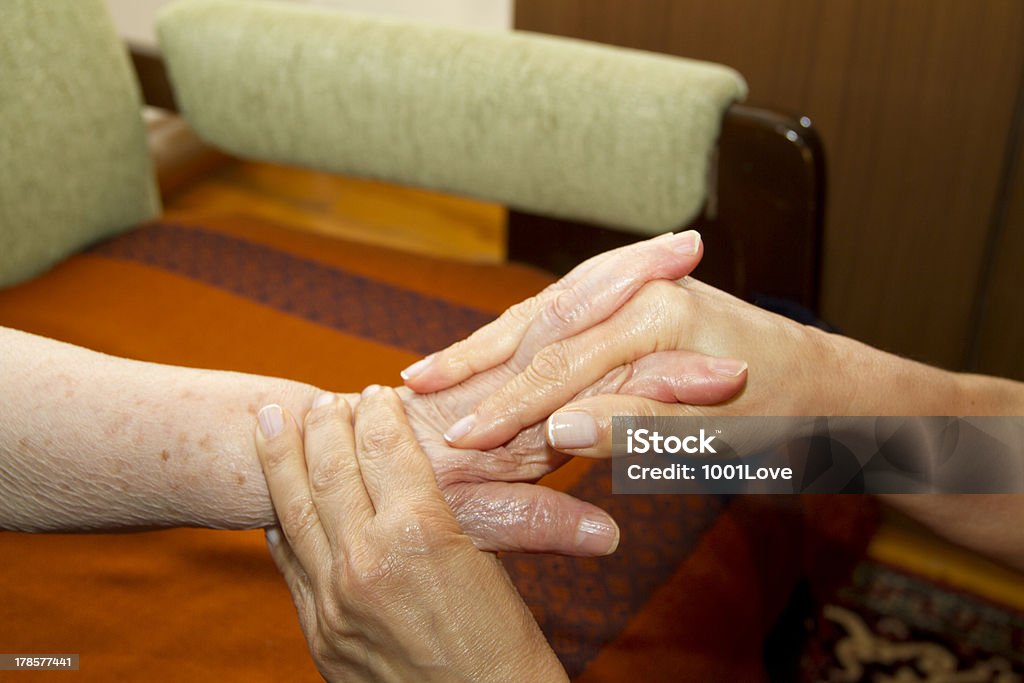 Physical Therapy for seniors Senior woman having physical therapy at home. 30-39 Years Stock Photo