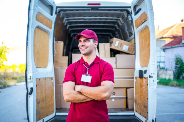 istock Male courier in front of a delivery van 1785776952