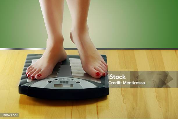 Woman Standing On Scales Stock Photo - Download Image Now - Adult, Beauty, Chris Mass