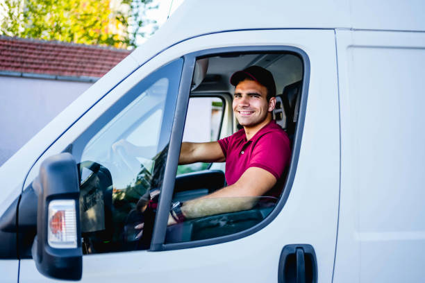 istock Young delivery man in the van 1785783991