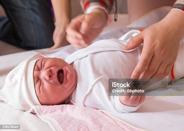 Newborn Baby Crying On The Bed Stock Photo - Download Image Now - Baby - Human Age, Crying, Newborn