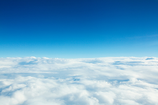 Background image of sunny blue sky with white clouds