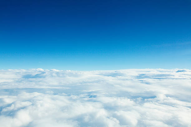 Photo of clouds from above and blue sky Blue sky background with white clouds above cloud stock pictures, royalty-free photos & images