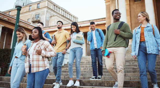 istock Students, diversity or walking on university steps, college campus or school stairs in morning class commute. Talking men, bonding women or education friends with learning goals in global scholarship 1785791426
