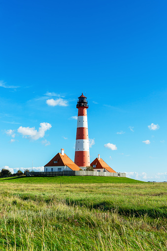 Westerheversand Lighthouse on Eiderstedt peninsula, Germany\nThere is a platform for visitor in the hight of 37 m. In the former houses of the lighthouse keeper are now exhibitions.