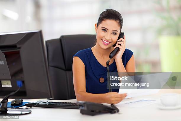 Secretary Answering Telephone Stock Photo - Download Image Now - Secretary, Businesswoman, Answering