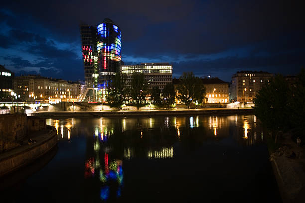 istock glass front of office tower by night 178580382