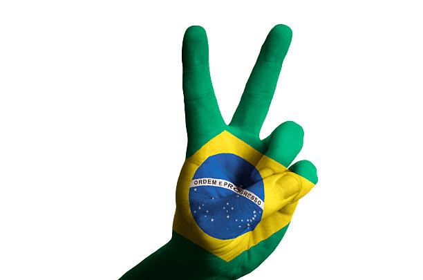 istock brazil national flag two finger up gesture for victory 178580415