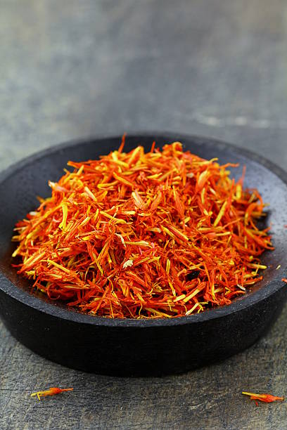 istock saffron treads in pile, wooden board 178580515