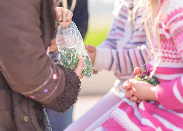 istock Group Of Friends Holding Marbles 178580728